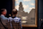 Two persons admiring a Magritte painting