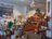 the interior of LIB: cacti, baskets, plants, pots and a wooden drinks cabinet
