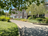 the alley of the auberge des 3 fontaine on a sunny day