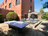 the sunny terrace of the Generation Europe Youth Hostel, with a table tennis table