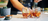Close up of bartender mixing cocktail with bar spoon